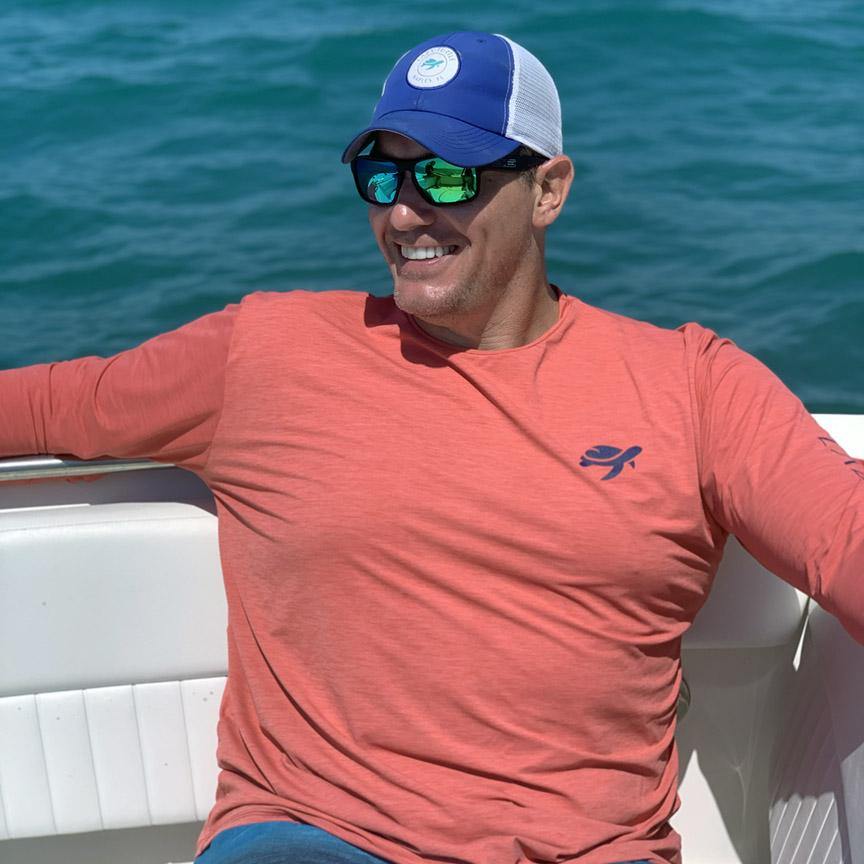 Man wearing Ocean Sun Safe Long Sleeve on boat