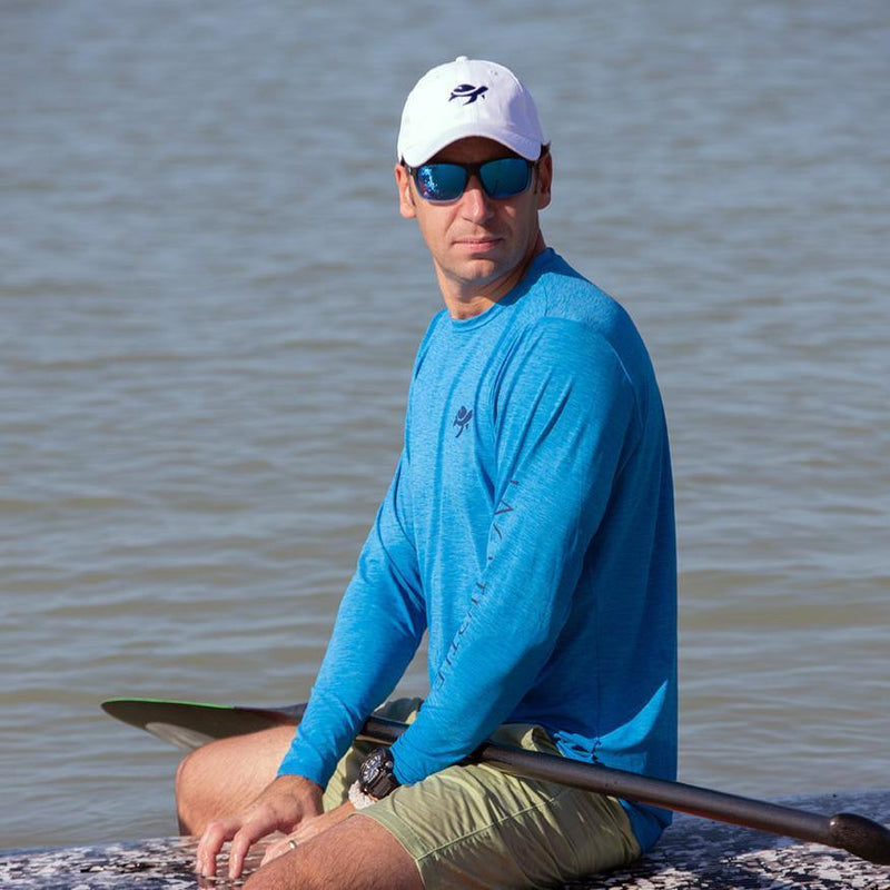 Man wearing Ocean Sun Safe Long Sleeve on paddle board